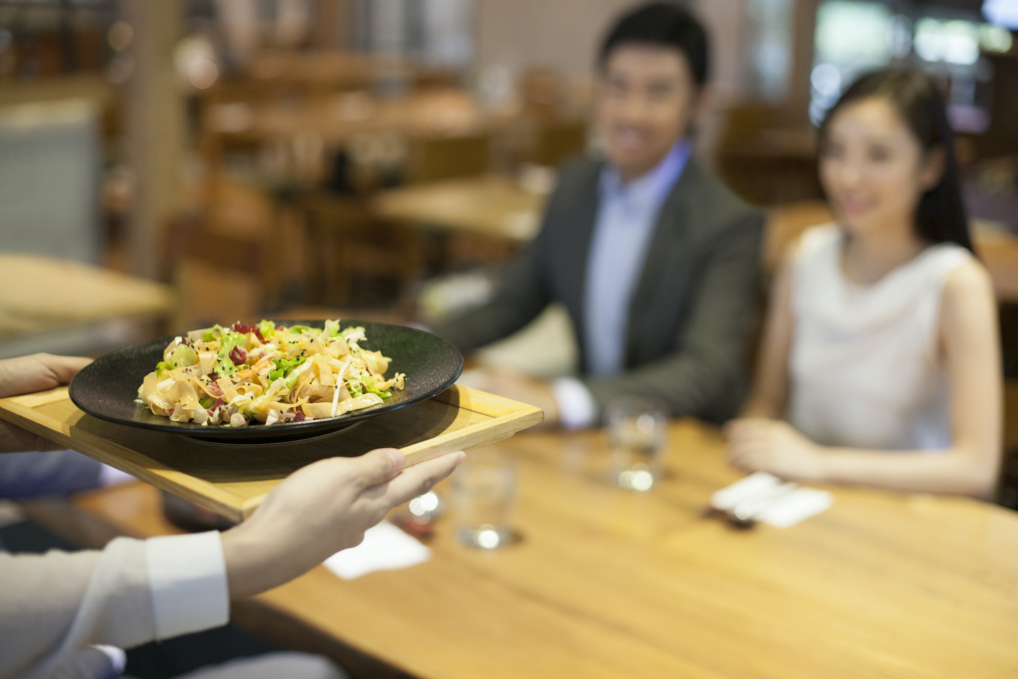 Waitress serving in restaurant