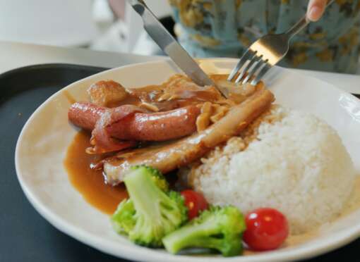 Woman eat at fast food restaurant